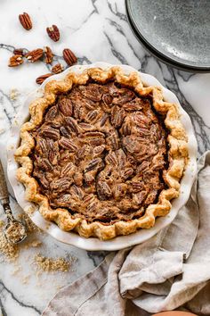 a pecan pie on a marble table