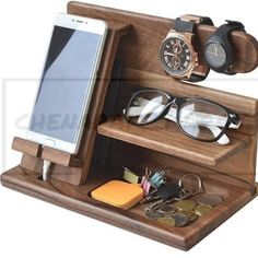 a cell phone and some glasses on a wooden stand