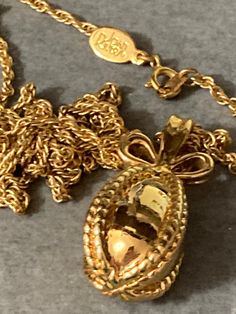 Joan Rivers Gold played Faberge inspired bow egg pendant necklace on 75cm rope chain  See last picture for others individual egg charms  I am selling ... Many rivers pieces listed please search Joan rivers within my Etsy shop for full range. I am also selling egg necklaces, bracelets and watches adorned with other designs. Selling Eggs, Gold River, Joan Rivers, Fan Earrings, Rope Chain, Modern Jewelry, Charms, Jewelry Necklace Pendant, Charm Bracelet