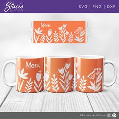 three orange mugs with white flowers and the words mom printed on them are sitting next to each other