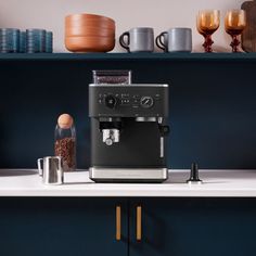 an espresso machine sitting on top of a counter