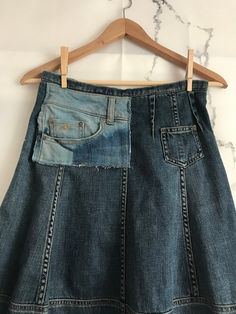 "One of a kind Anthropologie Holding Horses jean skirt with added O'Neill denim embellishment. Great skirt to wear with boots, booties, wedges or flats. Lots of outfit possibilities: cropped, tucked or untucked & belted tops or sweaters would all be nice additions. Get the \"Anthro vibe\" but be 100% unique! Purposefully exposed back zipper with ribbon pull tab. Waist 14\", hips 22\", length 27.5\"" Casual Reworked Denim Skirt, Casual Reworked Medium Wash Denim Skirt, Upcycled Cotton Denim Skirt, Casual Denim Skirt Upcycled, Casual Fitted Skirt Reworked, Casual Fitted Upcycled Denim Skirt, Denim Patchwork Skirt For Fall, Casual Upcycled Denim Skirt, Fall Denim Patchwork Skirt