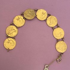 $ 2 1/2 Gold Indian Head US Gold Bracelet 8 Gold COIN Bracelet Total Weight 36.3 Gram It has some Wear and tear but bracelet is in very good condition, Excellent workmanship, Genuine Coins, American WWII workmanship Genuine Coins made into a bracelet, $2.5 Indian Head coins, aka quarter eagle, are %90 pure gold alloyed with Copper(Cu) which is giving a distinct reddish Orange-Yellow color to this coin. They're 18mm/ 0.7 inch in diameter, 4.18 gram in weight each. This is a well made bracelet tes Gold Coin Bracelet, Bracelet Stands, Eagle Coin, Retro Bracelet, Gold Link Bracelet, Vintage Tiffany, Coin Bracelet, Antique Coins, Gold Armband