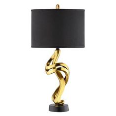 a table lamp with a black shade and gold metal design on the bottom, along with a dark brown drum light