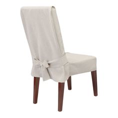 a gray chair with a bow on it's back and seat cover over the top