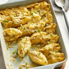 a casserole dish with chicken and vegetables in it