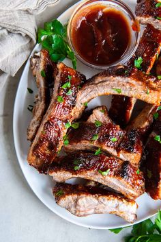 barbecue ribs with bbq sauce on a white plate