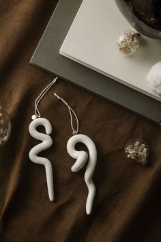 Whether you prefer your Christmas tree to be dazzled in bright colours or soft tones, our Doodle Ornaments will surely suit any tree with their whimsical and fanciful shapes inspired by real ice stalactites. Doodle Ornaments, Ceramic Chain, Ceramic Forms, Days Till Christmas, Danish Furniture Design, Cotton String, Burke Decor, Natural Forms