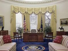 the oval room is decorated in red, white and blue with two desks on either side