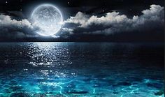 an ocean scene with the moon rising over the water and clouds in the sky above