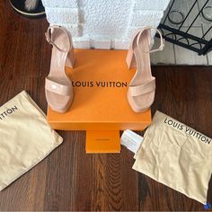 Louis Vuitton Nude Platform Sandal. Euro Size 39/Us 8.5. Metallic Logo Emblem On Back Of Heels And Raised Metallic Brand Name On The Fronts. Buckle Ankle Straps. Worn One Time And Mostly Seated, So There Is Minimal Scuffing On The Sole. They’re Truly Like New! Not To Mention Gorgeous! Comes In The Box With Dusters. Receipt From Purchase At Saks Fifth Avenue. Nude Platform Sandals, Logo Emblem, Dusters, Emblem Logo, Louis Vuitton Shoes, Ankle Straps, Metallic Logo, Saks Fifth, Saks Fifth Avenue