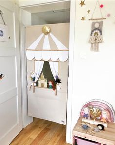 a child's room with a tent and toys