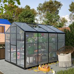 a small greenhouse with several plants in it