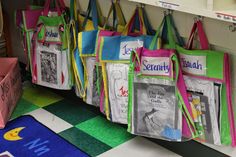 several colorful bags hanging on the wall