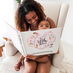 a woman sitting on a chair holding a book with a little jesus written on it