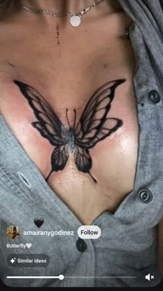 a woman with a butterfly tattoo on her chest