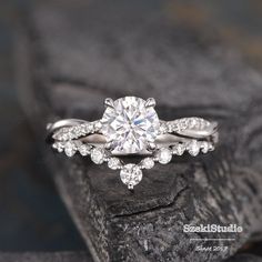 a white gold engagement ring with diamonds on top