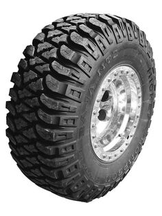 an all terrain tire on a white background