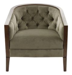 an upholstered chair with wooden legs and buttons on the back, in grey velvet