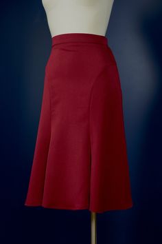 "The Florence-skirt is adapted from a 1930s sewing pattern. The skirt features curved seam lines that accentuate the hips, it fits snugly around the hips and flares out generously toward the knees. The flare at the bottom is close to a full circle! There is a zipper and a hook&bar closure on the side. This skirt is great for any modern vintage look, but it's especially made with dancers in mind, and looks great when you twirl. The skirt is made in a dark burgundy red suiting fabric. The fabric h Classic Fitted A-line Bottoms, Classic Fitted Flared Skirt, Fitted Flare Skirt In Solid Color, Solid Fitted Flare Skirt, Solid Color Fitted Flare Skirt, Solid Flared Fitted Skirt, Classic Fitted Bottoms With Flared Hem, Elegant Red Gathered Skirt, Elegant Flared Lined Skirt