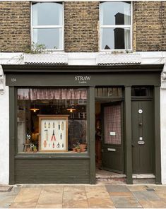 a store front with an assortment of items in the window