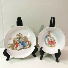 two plates with rabbits on them sitting next to each other