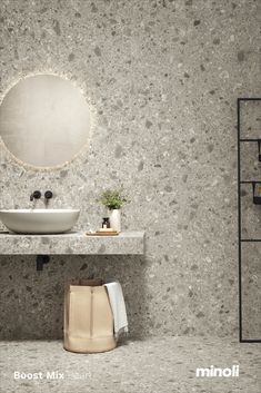 a bathroom with a sink, mirror and shelves on the wall next to each other