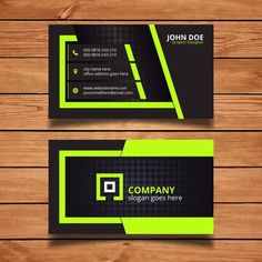 two business cards with green and black accents on wooden background - kosten stock - graffikts und bilder