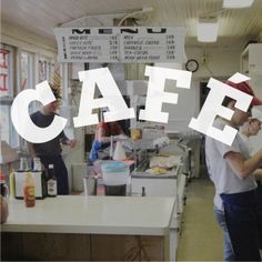 people standing in a kitchen with the word cafe overlayed on top of them