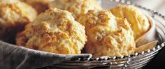 a basket full of biscuits sitting on top of a table