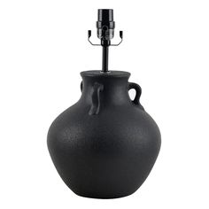 a black vase with a metal hook on it