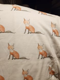 an orange fox print on a white sheet