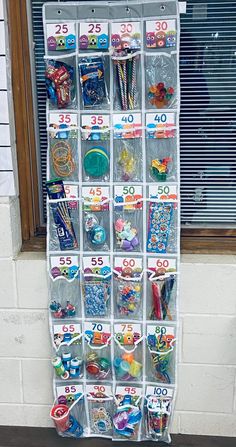 a display case filled with lots of different items next to a store front windowsill