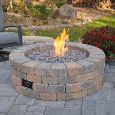 a fire pit sitting on top of a stone patio