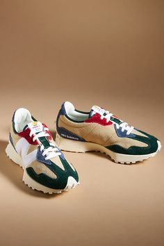 Making merry sneaker sweet. With a tried-and-true wedge silhouette, asymmetrical N, and wraparound, trail-inspired lug sole, the '70s-inspired heritage design of these sneakers make gifting a piece of cake. | 327 Sneakers by New Balance, Women's, Size: 9 at Anthropologie