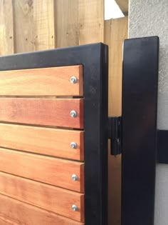 a close up of a wooden door with metal handles