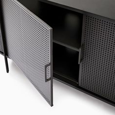 a black cabinet with an open door on the front and side panels that are perforated