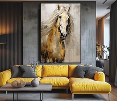 a living room with a yellow couch and large painting on the wall above it's coffee table