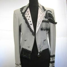 Ferrara Fashion Show Tux Mr. Anthony Ferrara Did Many Fashion Shows In The 1980's And 1990's. This Is One Of His Vintage Men's Tuxedo With Tails That He Altered And Redesigned. The Back Is Now Replaced With Sheer French Lace And Topped With A Hair Like Yarn And Black Braid Trim . Mr. Ferrara Used Puff Paint To Set Various Glass Stones As Well As Decorations Of Feathers , Lace, Braid, And Fancy Yarn. This Has It All!! The Size Is Men's 36 Reg And Will Fit A Small To Medium Woman . Last Picture Is From One Of The Fashion Shows! Black Lace Tuxedo Men, 1800s Tuxedo, Black Embellished Tailored Tuxedo, Mens Embellished Blazer, Semi-formal Black Embellished Tuxedo, Tuxedo With Tails, Prom Suits, Tuxedo For Men, Black Braids