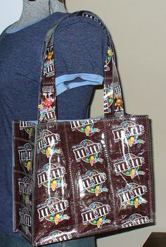 a person holding a bag with chocolate bars on it