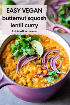 a purple pot filled with soup and garnished with cilantro