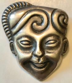 From my personal collection, I have loved this classic Mexican sterling artist piece signed M. Velazquez for 30 years and never considered selling it. The figural mask pin is signed by the artist and is made of sterling silver. It is a nice size and weight (SEE PICS) and looks fabulous at the nape of the neck or on a lapel of a coat or jacket. The unisex design makes it an instant classic. Signed Mexico 925 M. Velazquez, this Mexican Deco silver repousse portrait brooch likely dates to the 1940s Mayan Mask Art, Cultural Masks Mexico, Mayan Mask, Antique Silver Metal Brooch, African Mask Pendant, Decatur Ga, Piece Sign, Mexican Designs, Silver Brooch