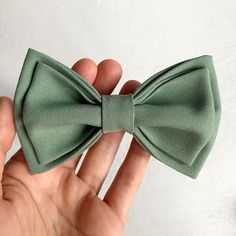 Sage green bowtie Groomsmen bowties for men Groom bowtie Size Adult bow tie 4,5 x 2 inches (11 x 6 cm) Neck 14 - 20,5 inch (35,5 - 52 cm ) Size Teenager 3,5 x 1,5 inches ( 9 x 3,8 cm) Size Baby 3 x 1 inches ( 7,5 x 3 cm) The size of the neck is adjustable The Bow tie is packaged in a wonderful kraft box with a bow. You will have a perfect and unique gift! The Bow tie is handmade and created with huge love! Colors will suit costumes and everyday outfits. Only natural materials were used. You have Bowtie Men's Outfit, Green Bowtie Groomsmen, Classic Green Bow Tie For Gifts, Classic Green Bow, Classic Green Bow Tie For Party, Classic Green Bow Tie With Satin Bow, Classic Green Bow With Bow Tie Back, Green Bow Tie For Black Tie Events, Green Tie With Decorative Bow For Formal Occasions