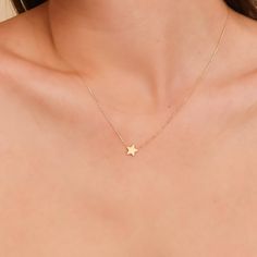 Capella A night sky’s dream. Add a touch of celestial magic to your everyday style with this dainty Mini Star Necklace, crafted entirely in solid gold. This dainty piece features a tiny, gleaming star pendant suspended on a shimmering chain, catching the light with every movement. Wear it on its own for a whisper of understated elegance or layer it with other necklaces for a bolder, personalized look. - Handmade- Solid Gold- Star Size: 8 mm All pieces come beautifully boxed in suede pouches you can always use when traveling! Gold Star Necklace, Celestial Magic, Simple Jewellery, Necklace Star, Star Necklace Gold, Gold Necklace Simple, Magical Jewelry, Tiny Star, Dainty Gold Necklace