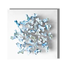 blue and white paper butterflies on a white background