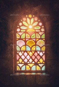 an old stained glass window with light coming through it - stock photo - photoshop