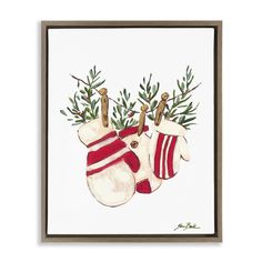 a christmas card with stockings hanging from a clothes line and pine branches on the top