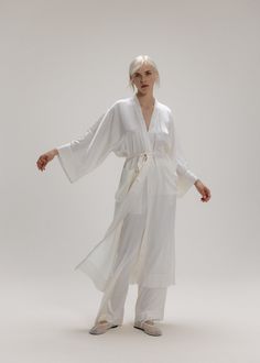 Long classic silk robe in original kimono cut, oversized and square pockets and matching silk belt. Set on reusing traditional design for a modern twist silk kimono robe brings both tradition and style. Composition: -100% 26mm 6A washable mulberry silk  Cleaning & care: -The temperature for washing is not above 30c degrees. -Washing machine - silk washing program. -Don’t use harsh detergents. -Do not wring. -Do not use bleach. -Do not tumble dry. -Do not dry in the sun. Silk Kimono Robe, Silk Robe, Brand Magazine, Nightwear Women, Silk Kimono, Blazer With Jeans, Square Scarf, Tie Shoes, Pearl Jewellery Earrings