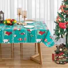 a table with a christmas tree next to it