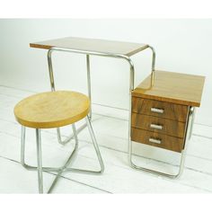 two small tables with drawers on each side, one has a wooden top and the other has metal legs